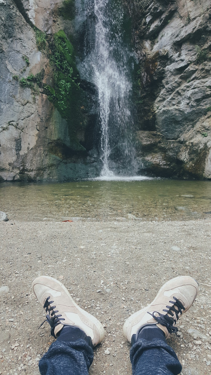 Sitting in front of waterfall